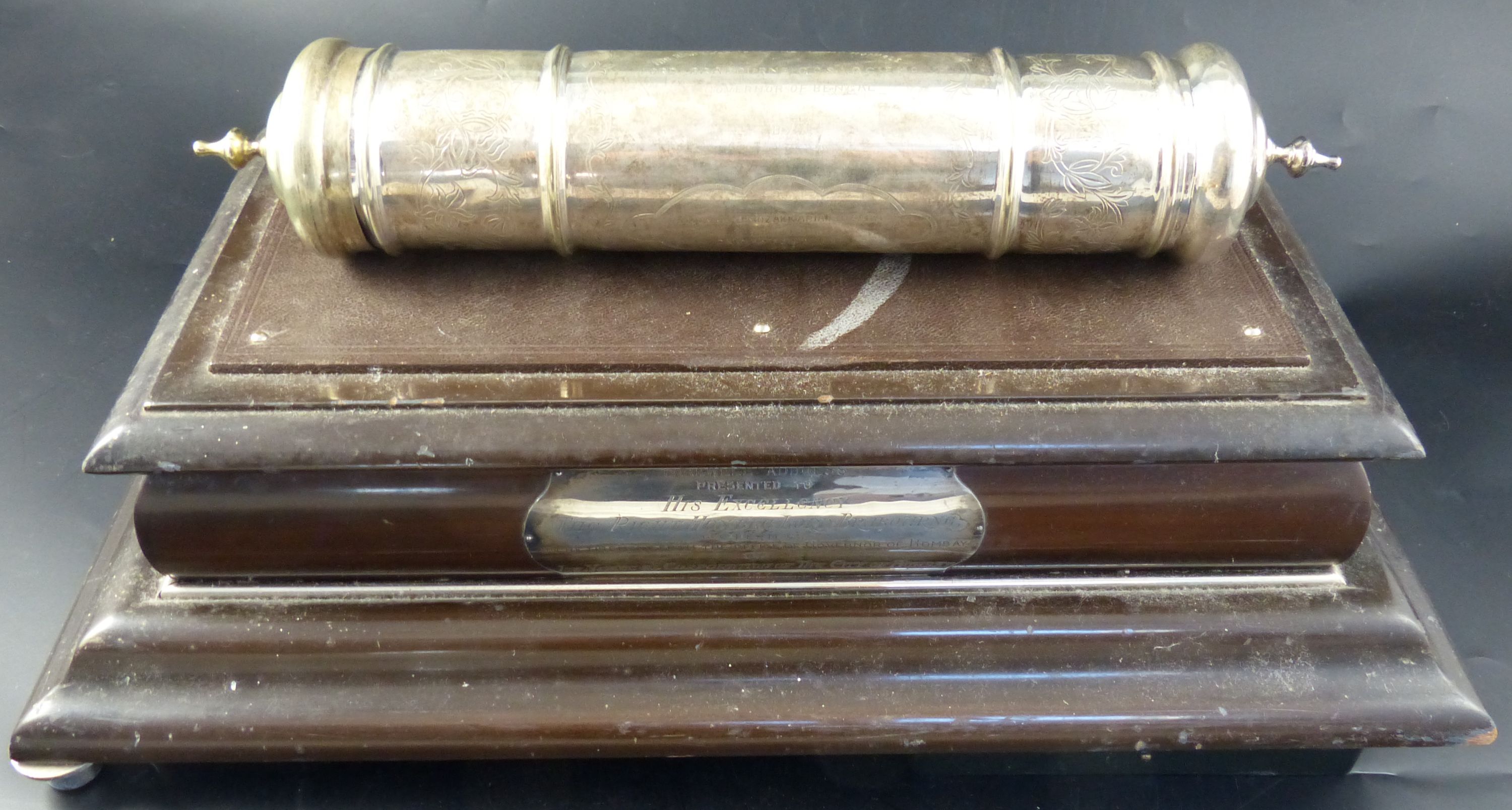 A 1930s Indian silver plated scroll case with presentation inscription to Lord Brabourne, 1938, 38cm and a stand. stand